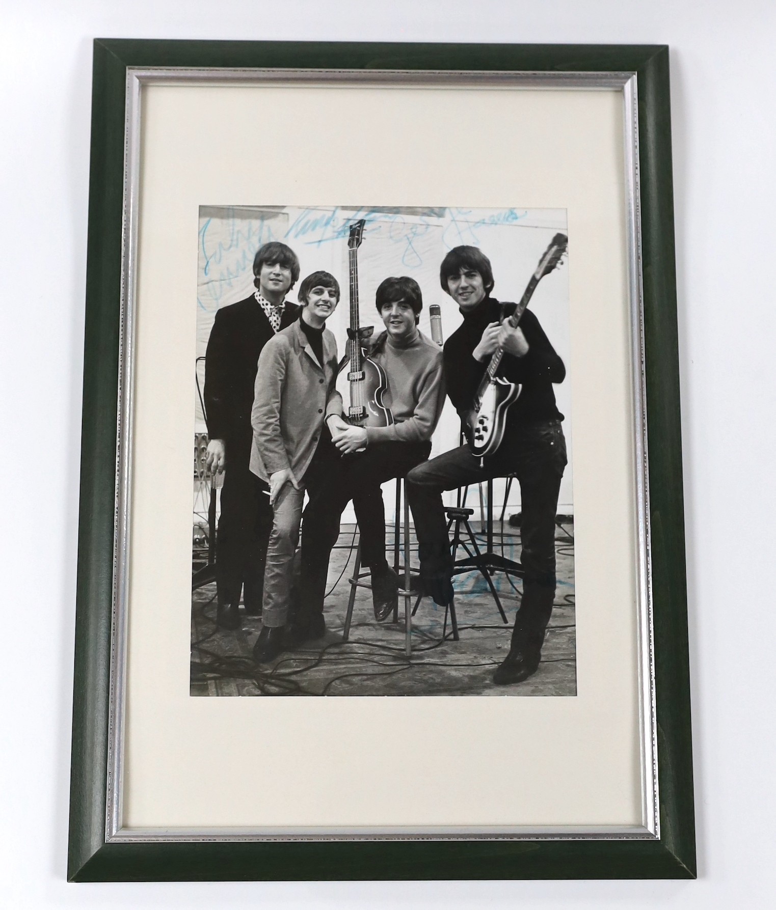 A Beatles signed photo in glazed frame, 23 x 17cm, bearing the signature of all four members with accompanying provenance in letter
